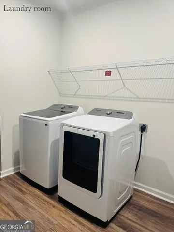 a view of a garden with wooden fence