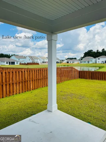 a view of swimming pool with outdoor seating