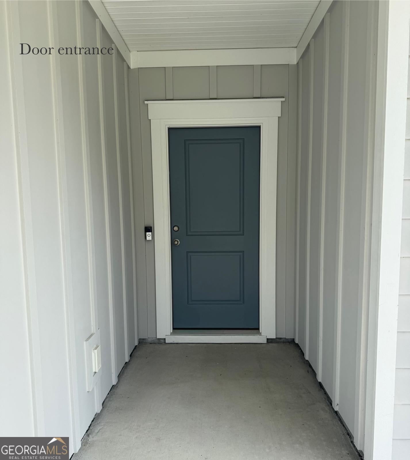 67 Shade Tree Drive Richmond Hill, GA 31324 - Photo 3 of 25 a view of a hallway with wooden door