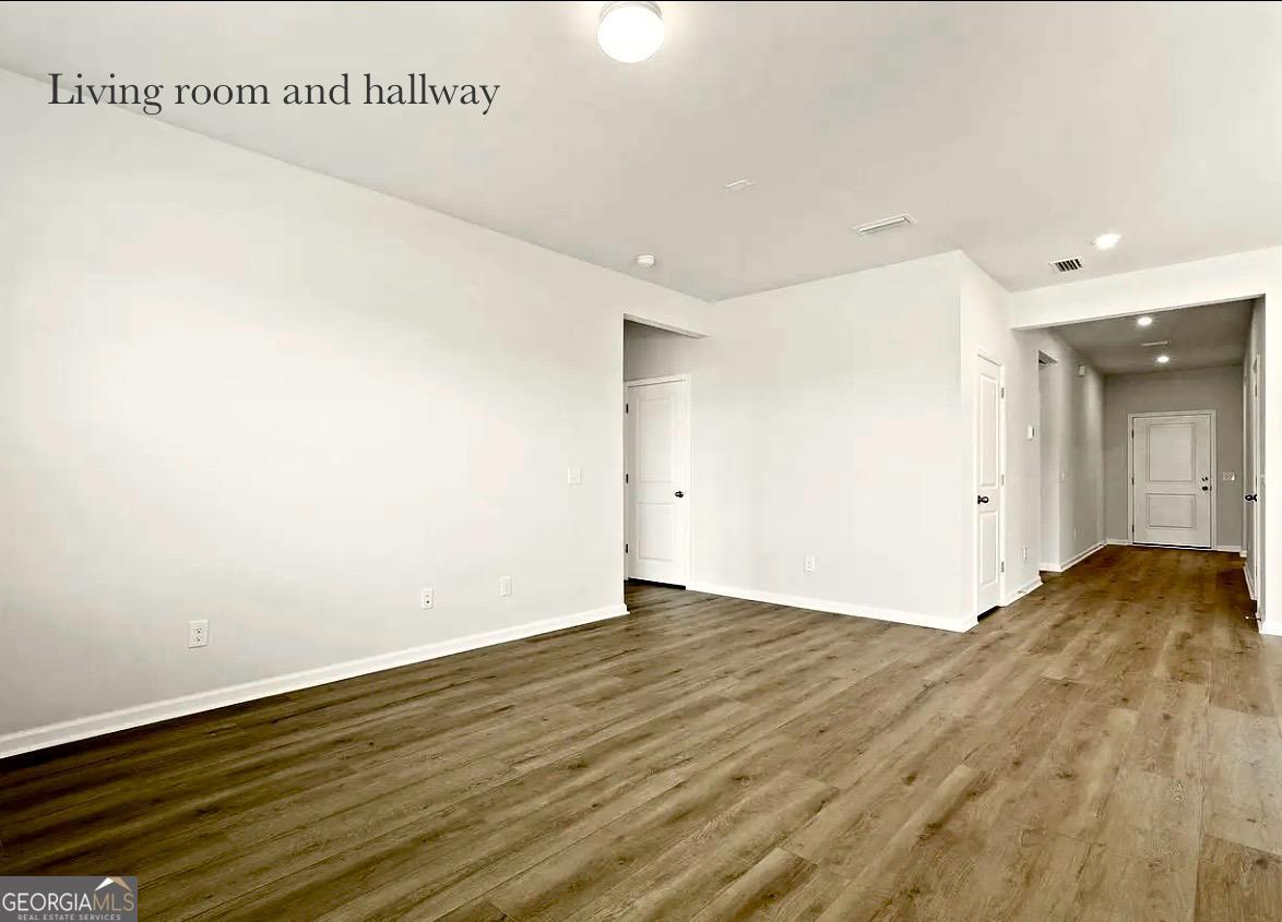 67 Shade Tree Drive Richmond Hill, GA 31324 - Photo 10 of 25 a view of livingroom with wooden floor