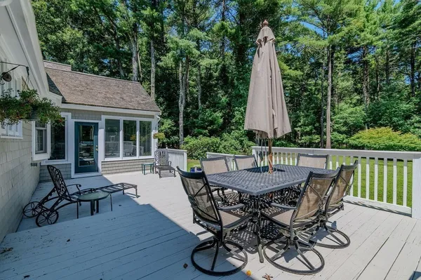 a view of a patio with a table and chairs