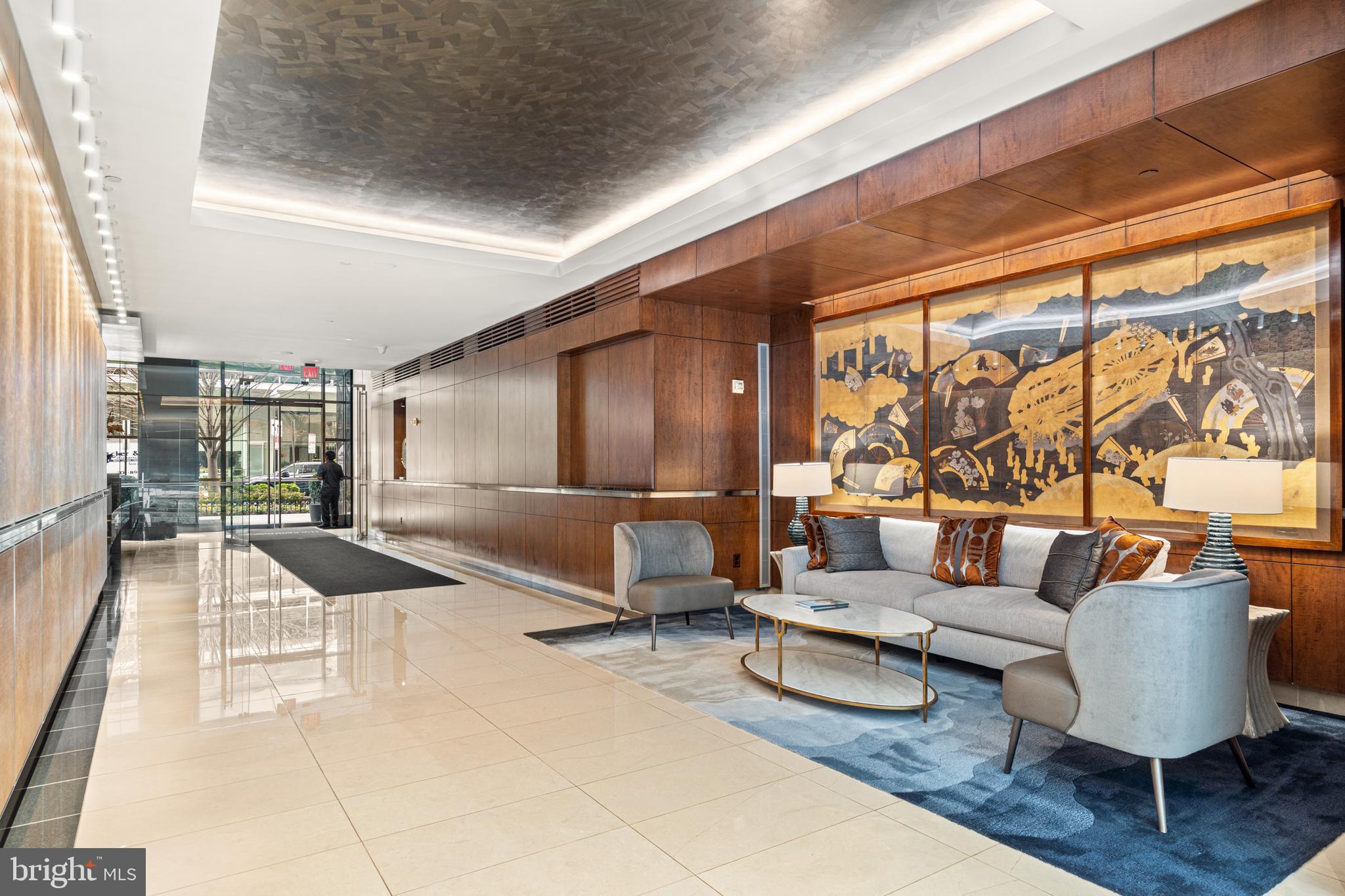 1111 23rd Street Northwest, Unit 4C Washington, DC 20037 - Photo 2 of 45 a living room with furniture and a large window