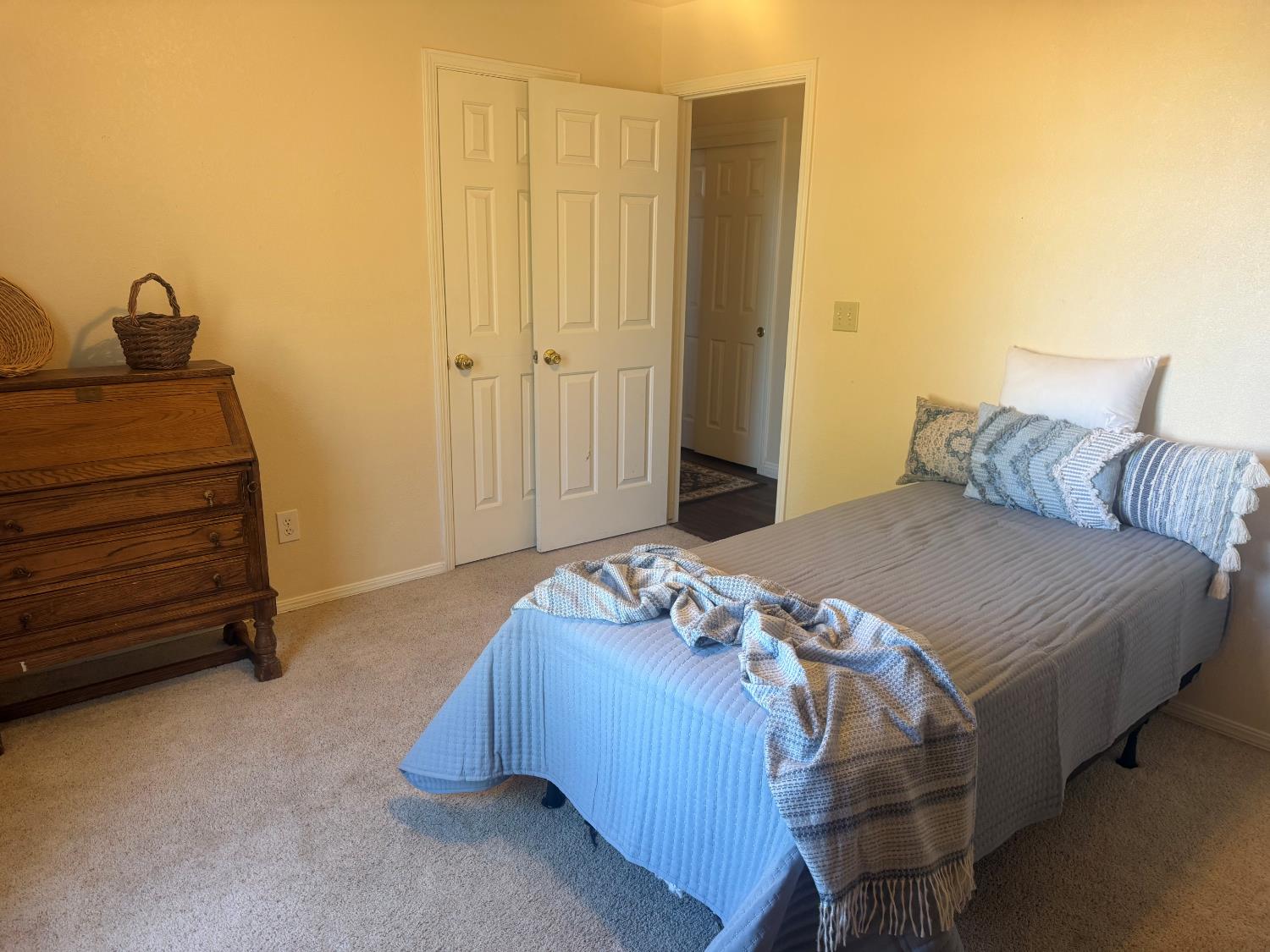 16638 Mark Road Madera, CA 93636 - Photo 15 of 22 a bedroom with a bed and a dresser