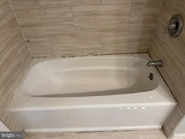 a close view of a bathtub in bathroom