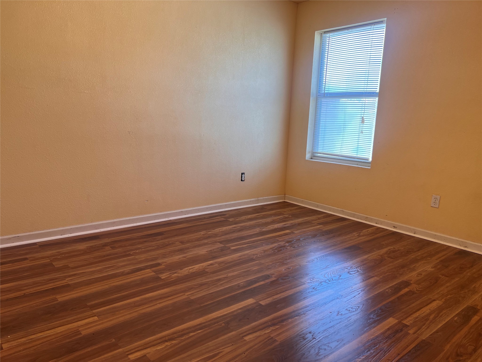 1305 Vista Road Pasadena, TX 77504 - Photo 16 of 17 a view of an empty room with wooden floor and a window