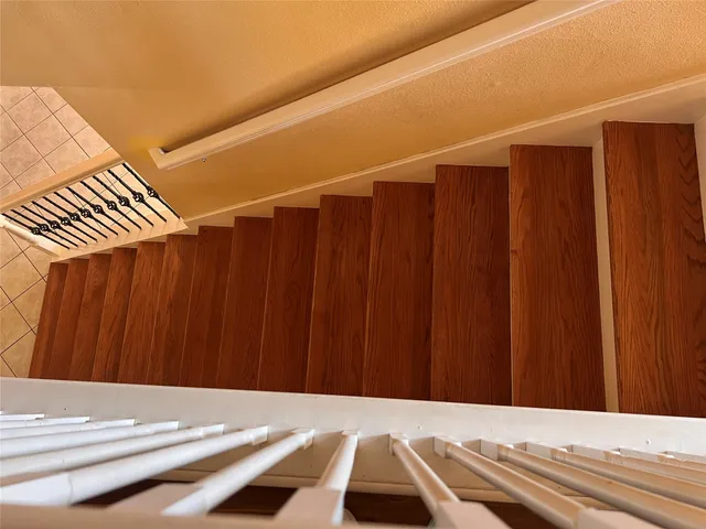 a view of a room with a wooden door