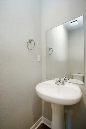 a bathroom with a sink and mirror