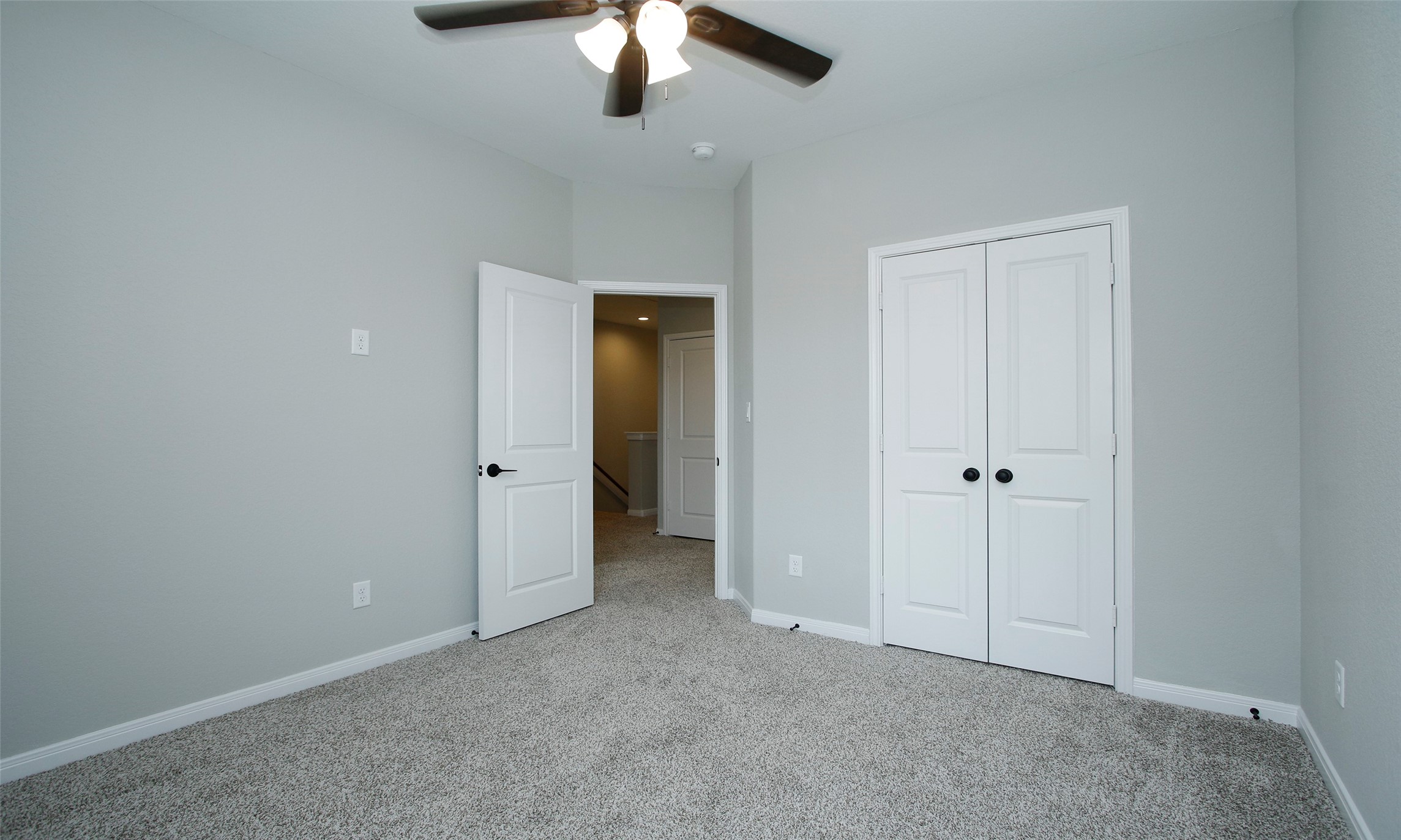 14010 Longstreet Road, Unit 1B Willis, TX 77318 - Photo 21 of 44 an empty room with chandelier fan