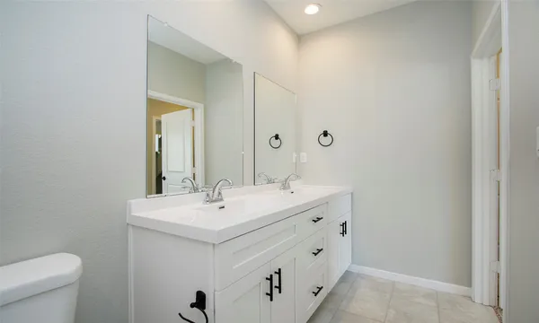 a bathroom with a sink and a toilet