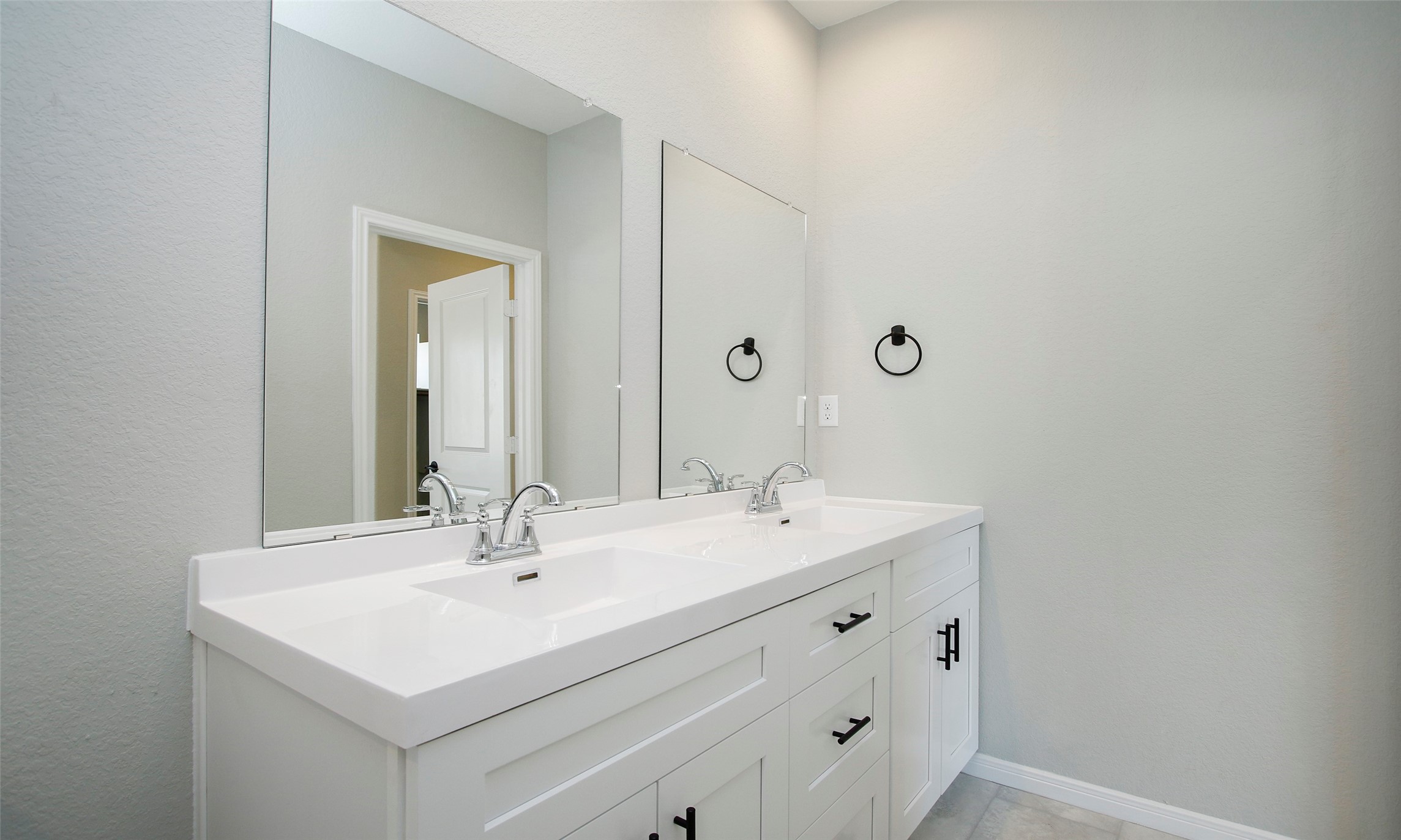 14010 Longstreet Road, Unit 1B Willis, TX 77318 - Photo 28 of 44 a bathroom with a sink and a mirror