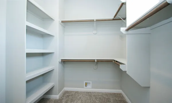 a view of an empty walk in closet