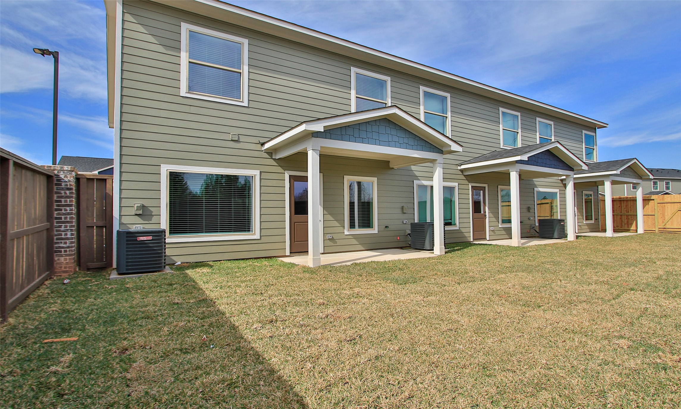14010 Longstreet Road, Unit 1B Willis, TX 77318 - Photo 40 of 44 a front view of a house with a yard
