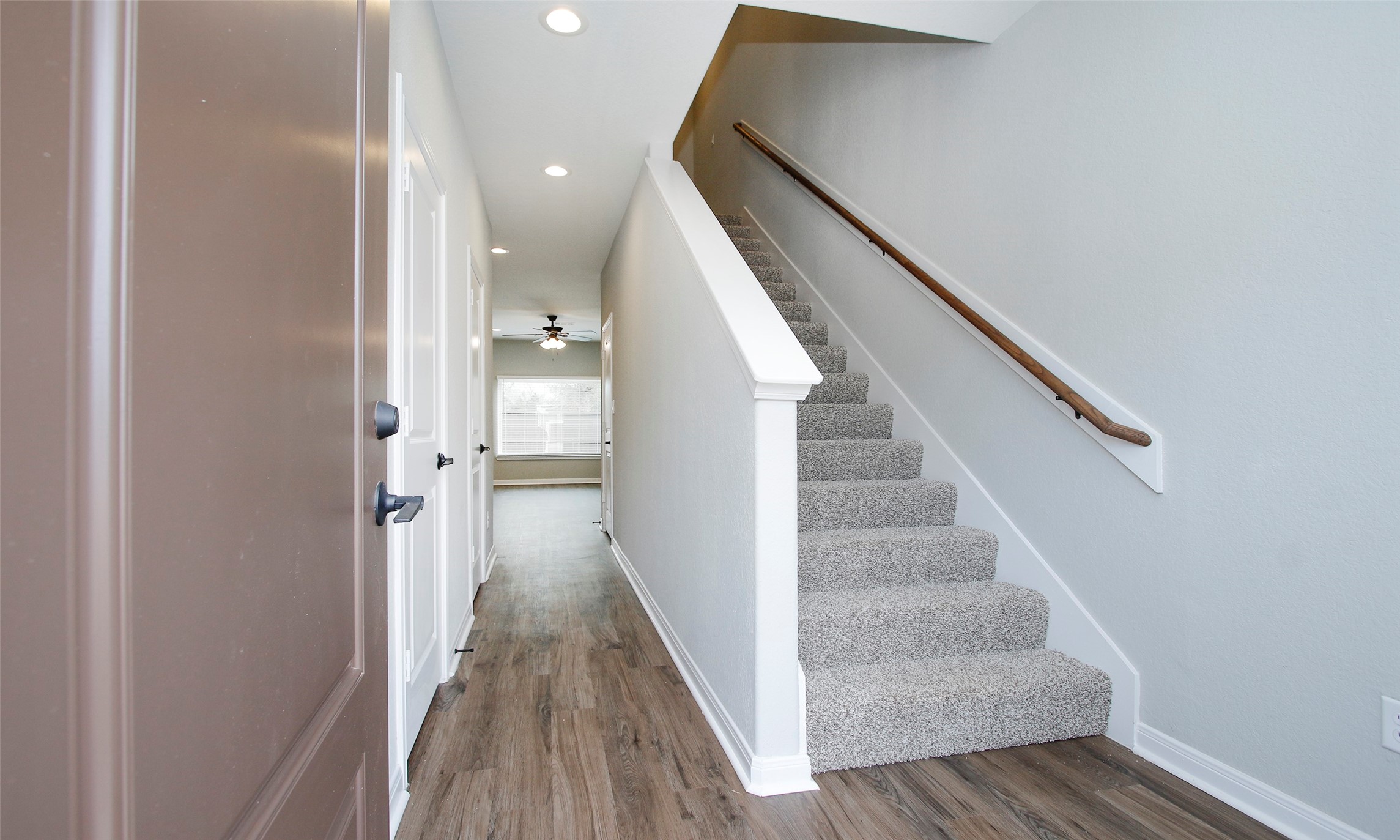 14010 Longstreet Road, Unit 1B Willis, TX 77318 - Photo 5 of 44 a view of a hallway with wooden floor and entryway