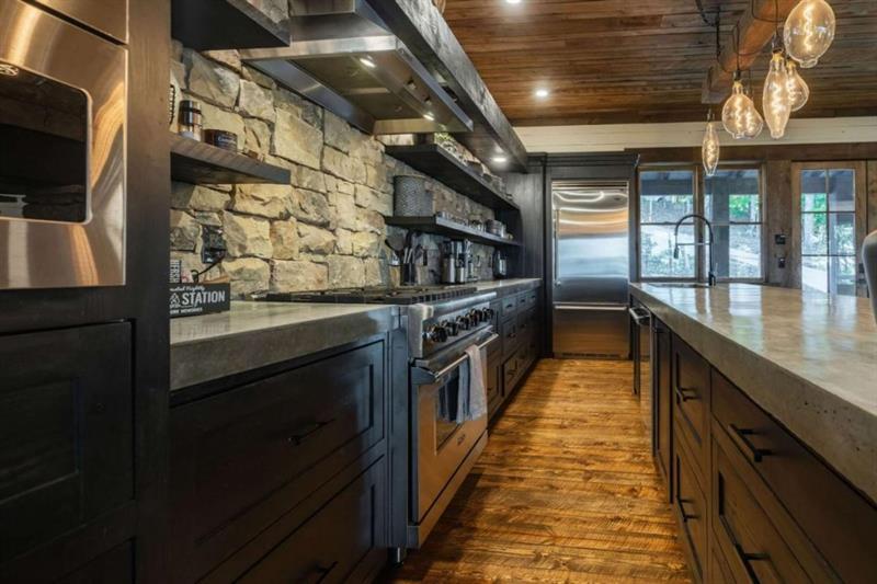 224 Eagles Ridge Morganton, GA 30560 - Photo 15 of 73 a kitchen with stainless steel appliances granite countertop a stove and a sink