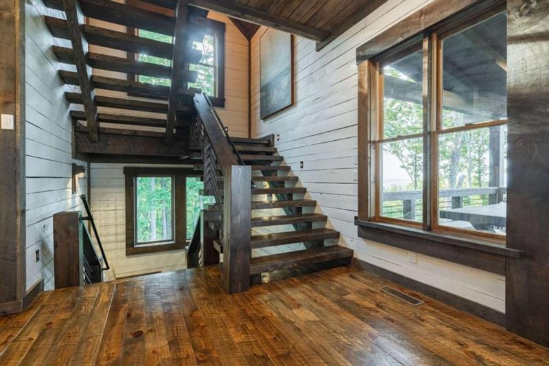 224 Eagles Ridge Morganton, GA 30560 - Photo 29 of 73 a view of entryway with wooden floor and stairs