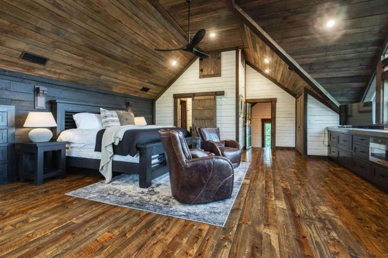 224 Eagles Ridge Morganton, GA 30560 - Photo 32 of 73 a living room with furniture a fireplace and wooden floor