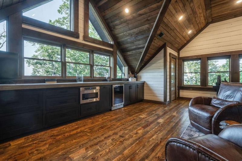 224 Eagles Ridge Morganton, GA 30560 - Photo 34 of 73 a view of a livingroom with furniture wooden floor windows and a ceiling fan