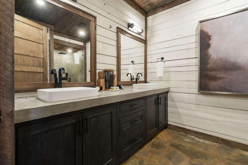 224 Eagles Ridge Morganton, GA 30560 - Photo 43 of 73 a bathroom with a double vanity sink and a mirror