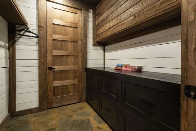 a view of a chairs and table in a balcony