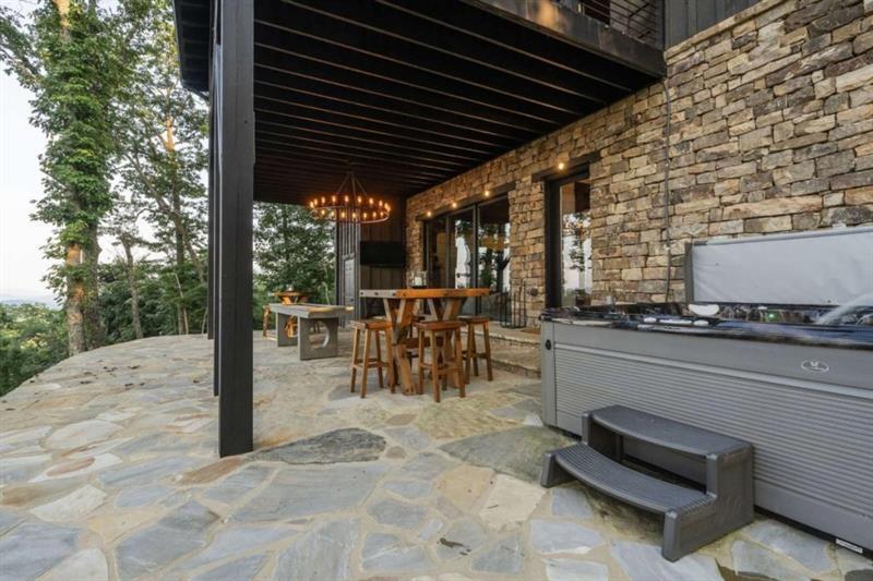 224 Eagles Ridge Morganton, GA 30560 - Photo 48 of 73 a view of a patio with a table and chairs and a barbeque