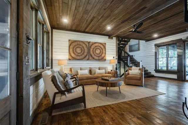 a living room with furniture and a clock