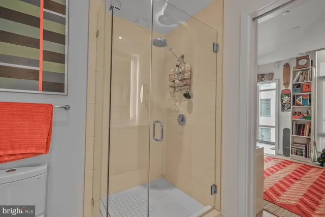 a bathroom with a shower and a sink