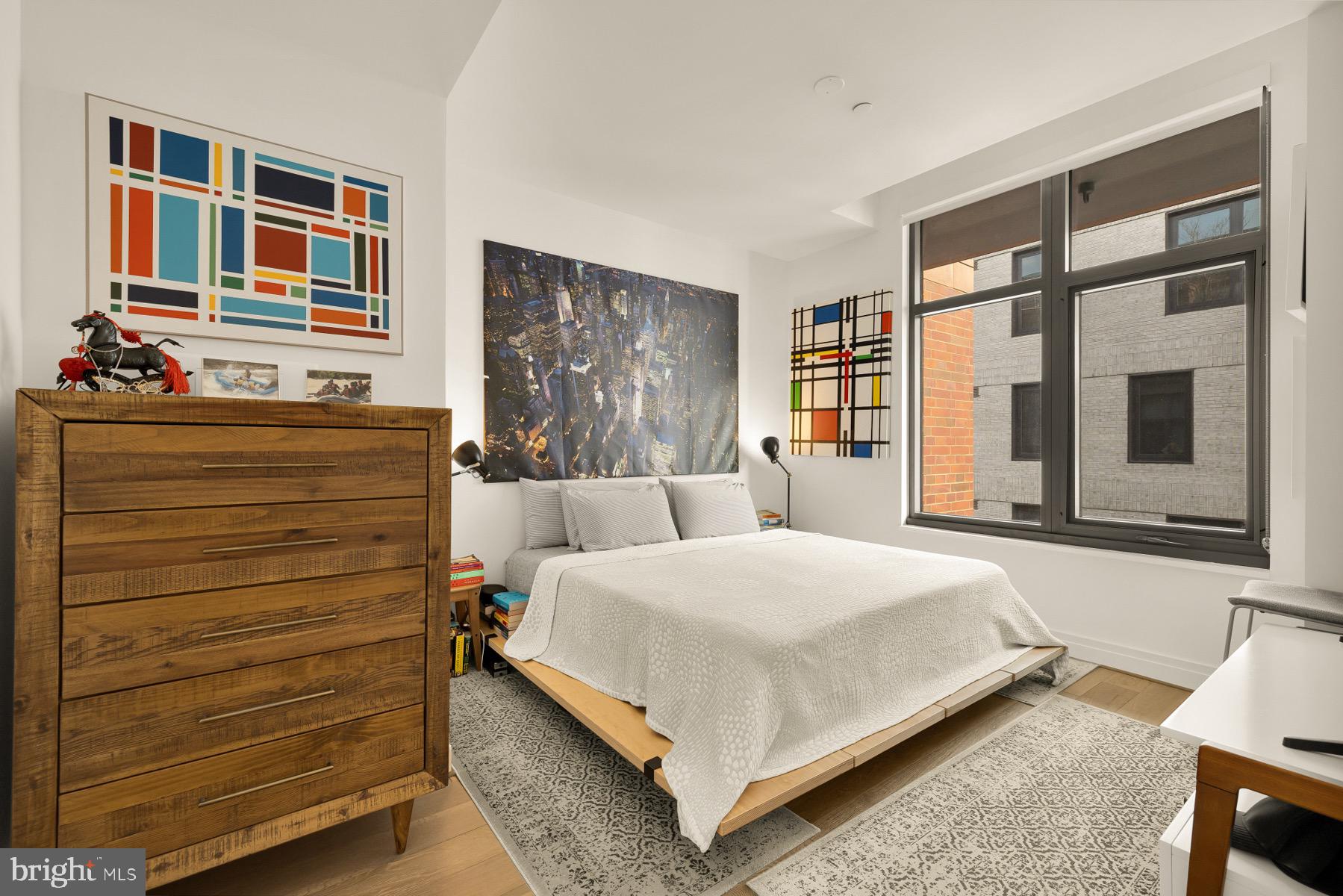 810 O Street Northwest, Unit 809 Washington, DC 20001 - Photo 17 of 30 a bed room with a bed and a window