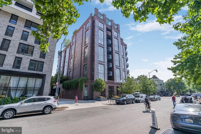 a car parked in front of brick building