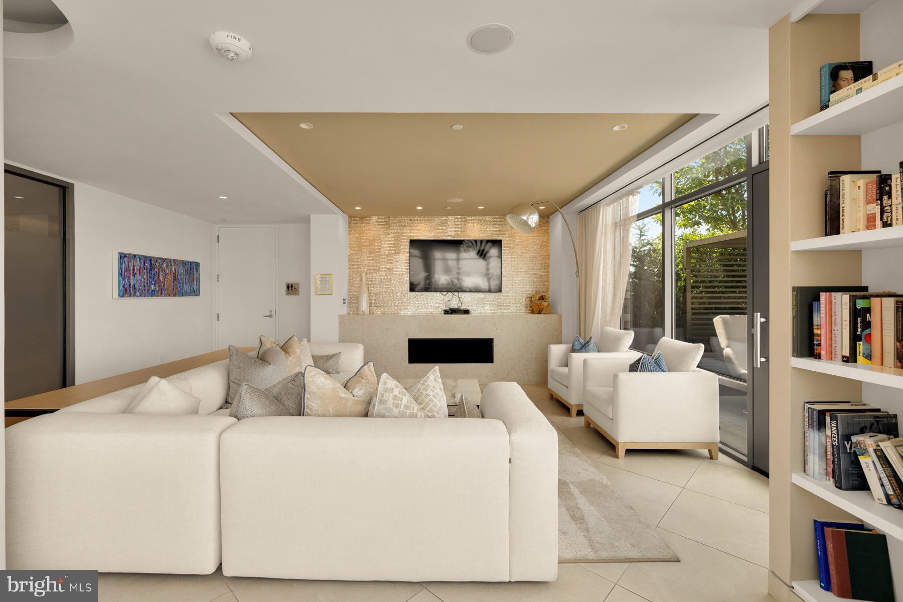 810 O Street Northwest, Unit 809 Washington, DC 20001 - Photo 22 of 30 a living room with furniture and a book shelf