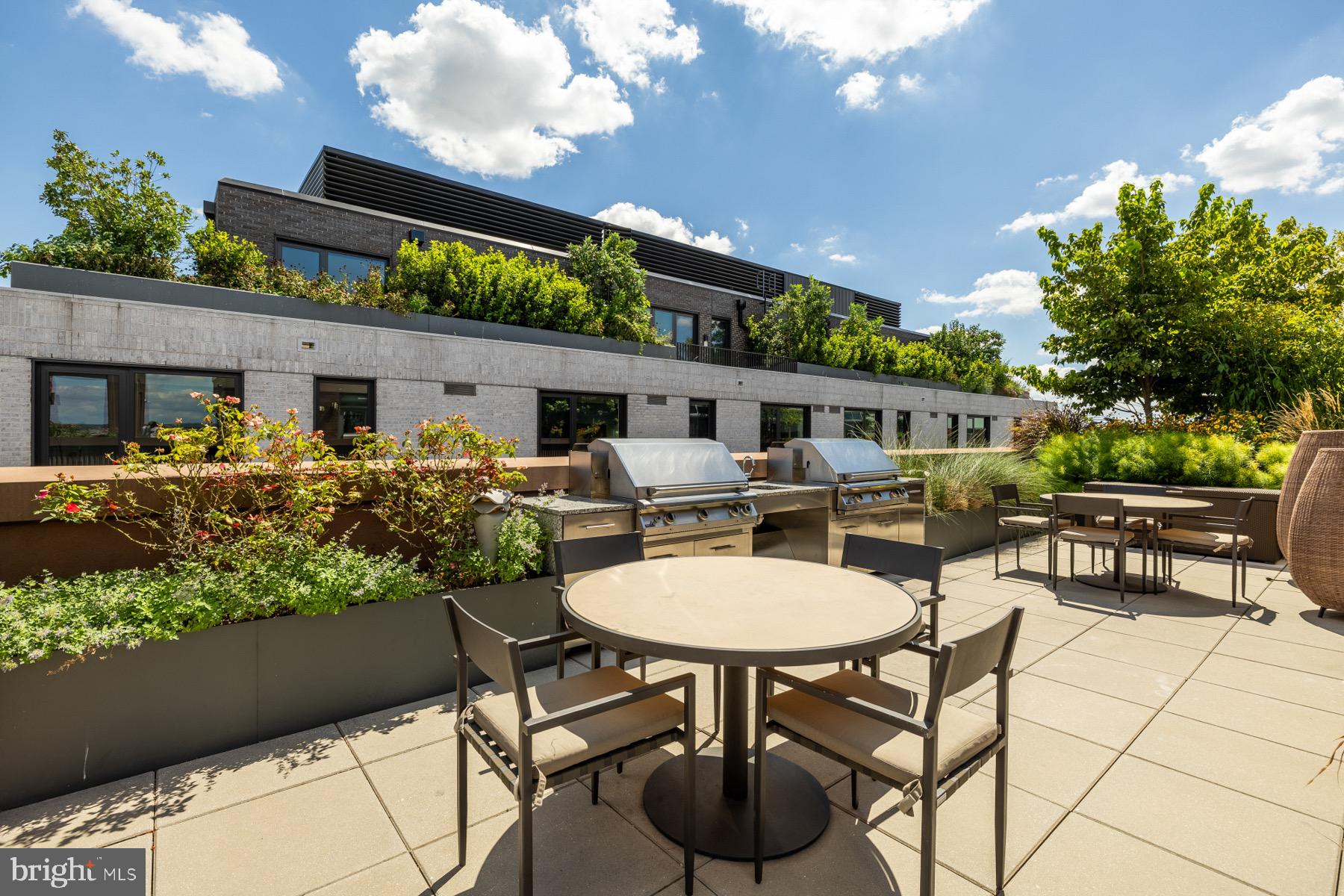 810 O Street Northwest, Unit 809 Washington, DC 20001 - Photo 25 of 30 a patio with table and chairs