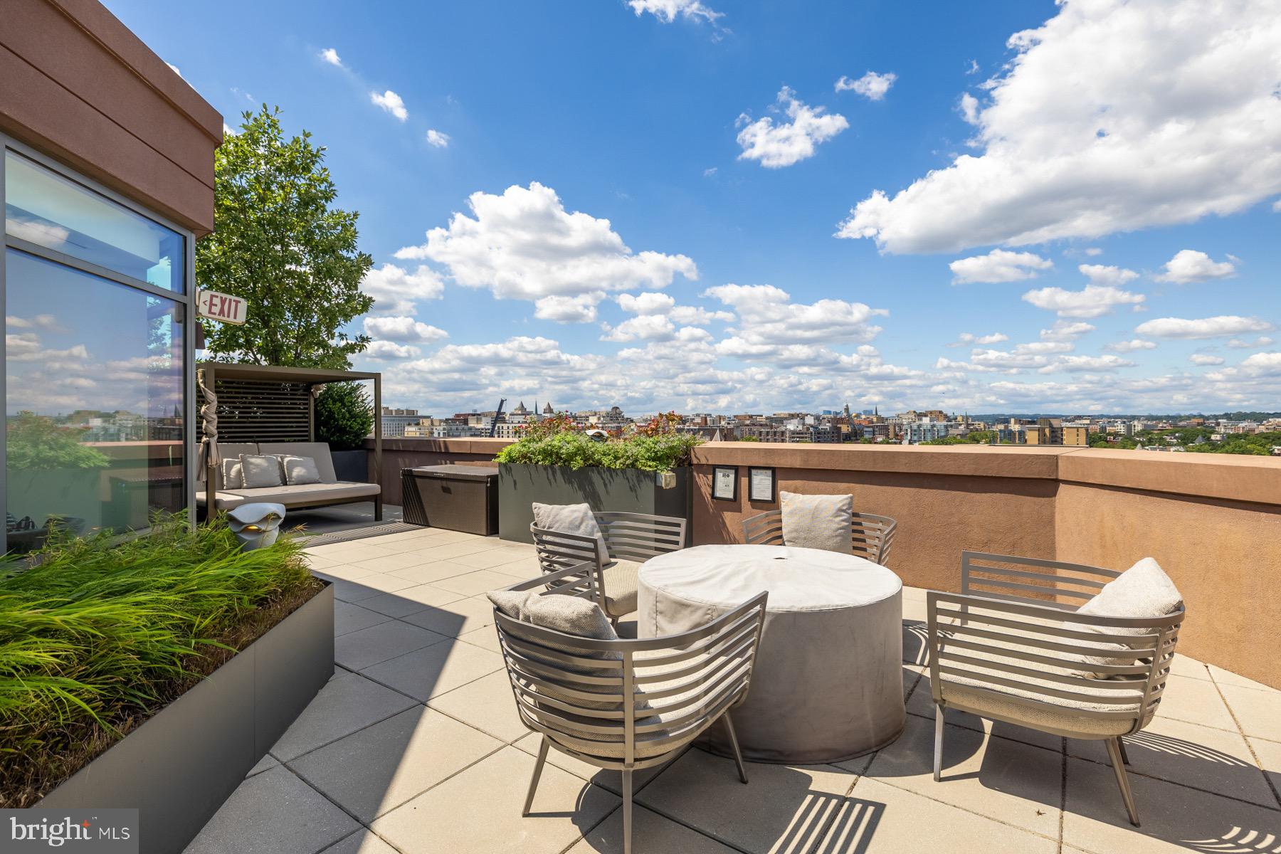 810 O Street Northwest, Unit 809 Washington, DC 20001 - Photo 26 of 30 a view of a terrace with couches chairs and a fire pit