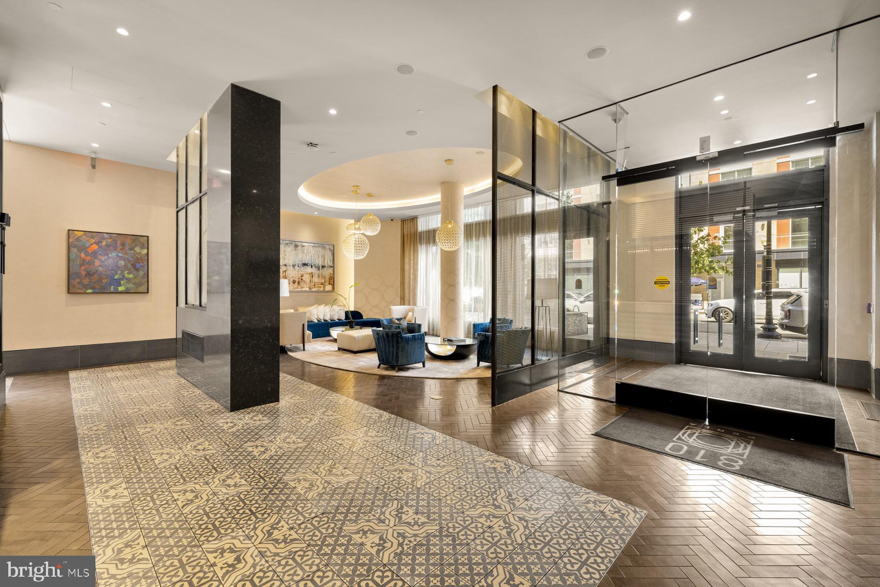810 O Street Northwest, Unit 809 Washington, DC 20001 - Photo 28 of 30 a lobby with furniture and floor to ceiling window
