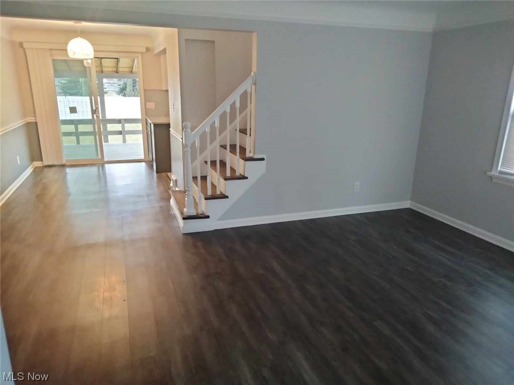 11620 Granger Road Cleveland, OH 44125 - Photo 7 of 14 Spare room featuring dark hardwood / wood-style floors