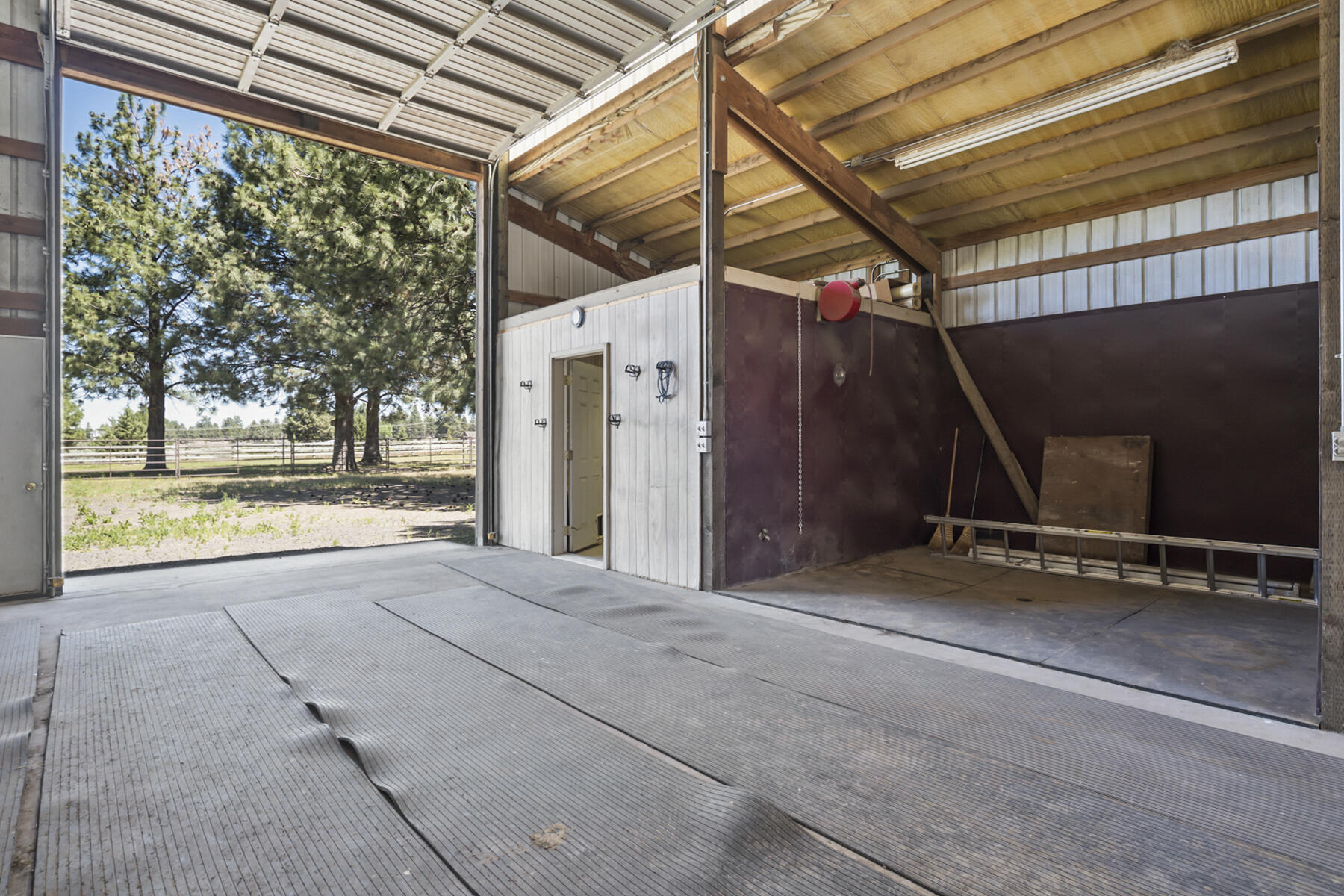 60696 Tekampe Road Bend, OR 97702 - Photo 59 of 61 a view of a room with wooden floor and windows