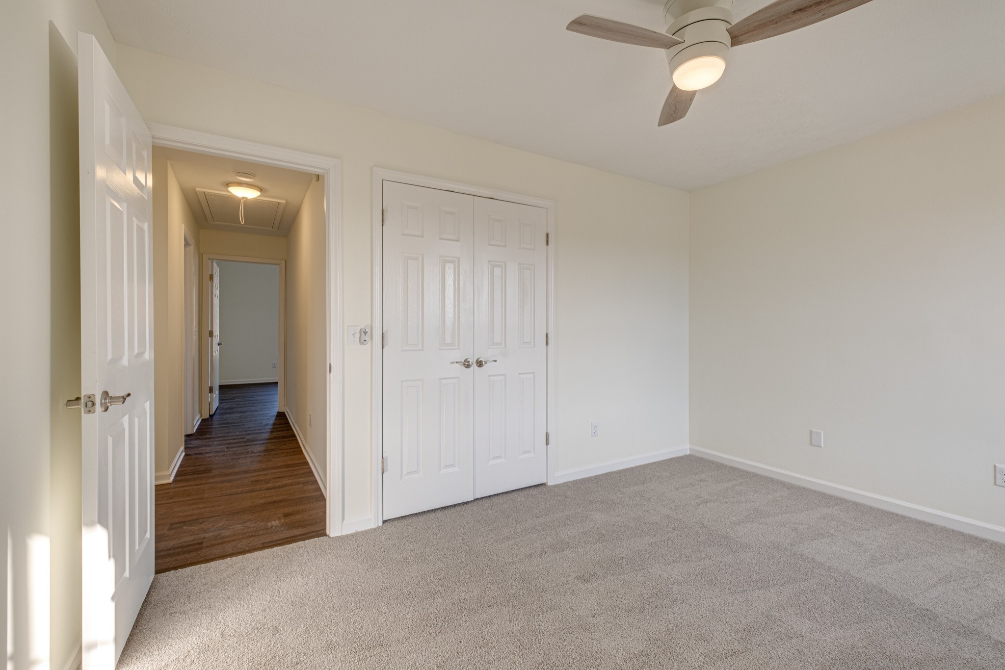 1029 Windtree Trace Mount Juliet, TN 37122 - Photo 14 of 18 an empty room with a hallway and wooden floor