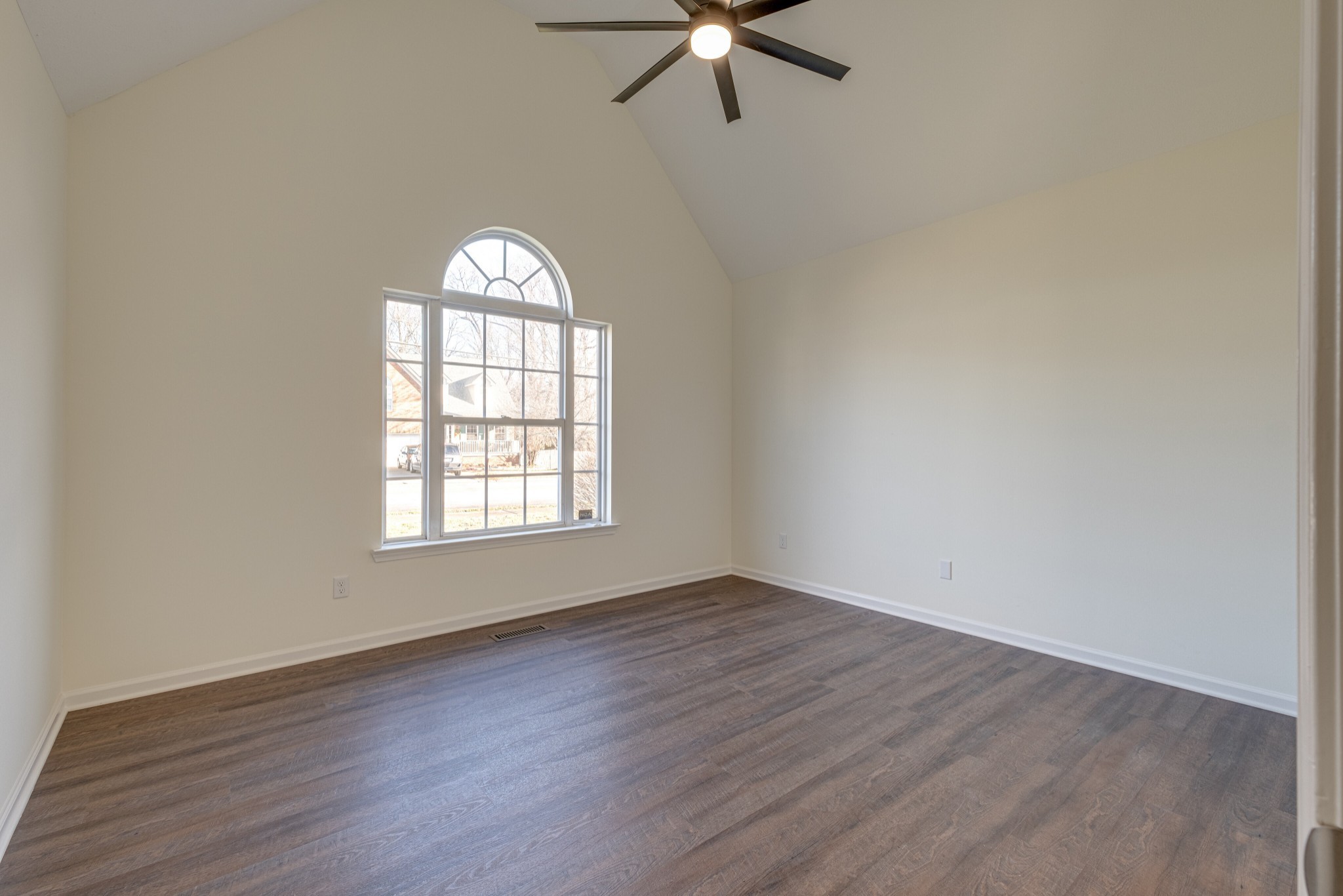 1029 Windtree Trace Mount Juliet, TN 37122 - Photo 7 of 18 an empty room with wooden floor fan and windows