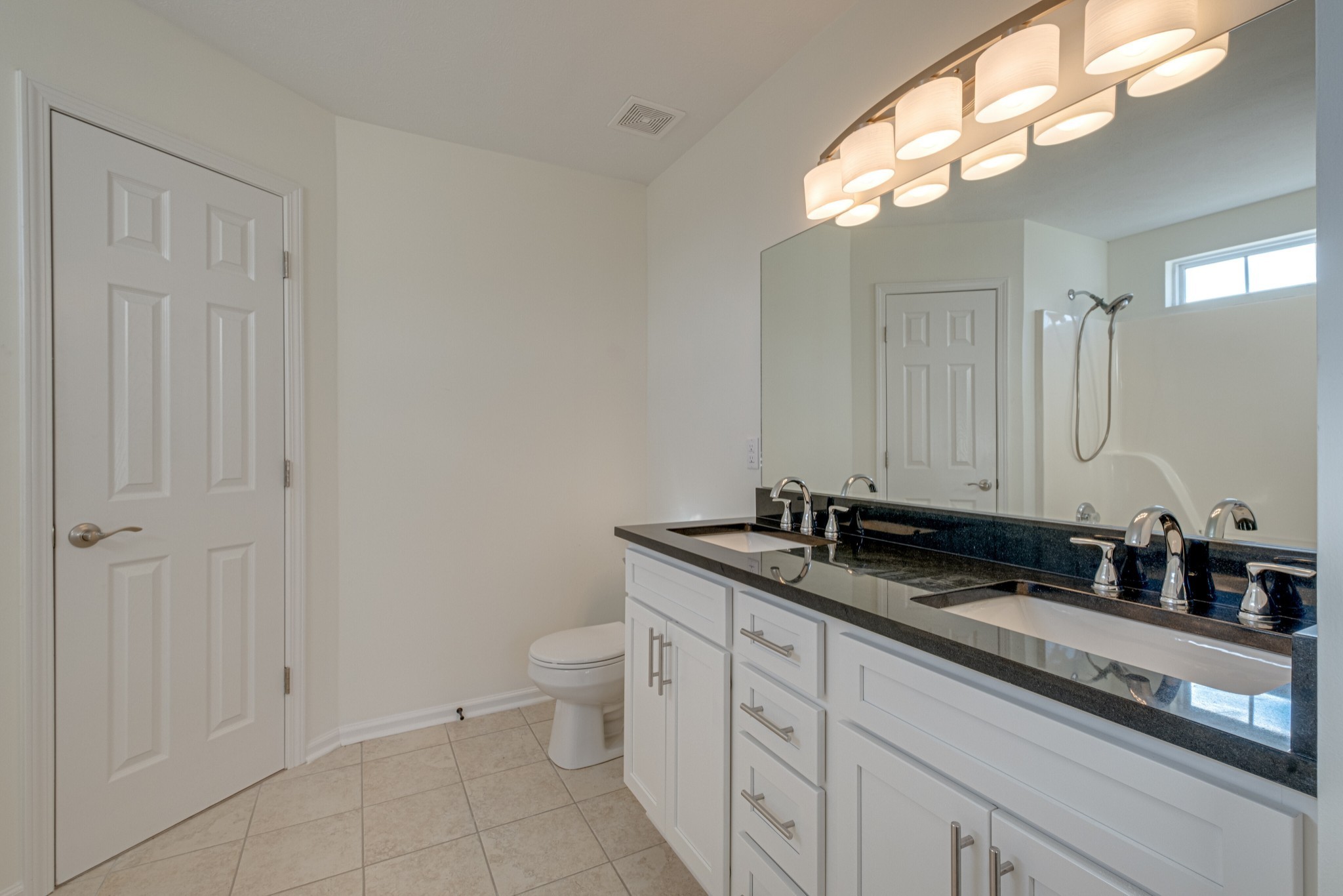 1029 Windtree Trace Mount Juliet, TN 37122 - Photo 9 of 18 a bathroom with a granite countertop sink a toilet and a mirror