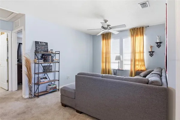 a living room with furniture and a window