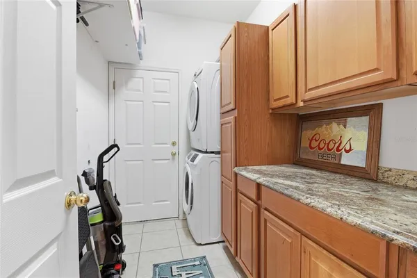 a balcony with wooden floor and outdoor seating