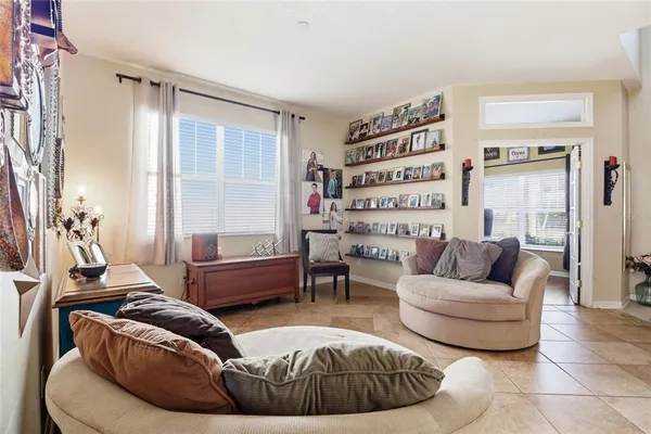 a living room with furniture and a large window