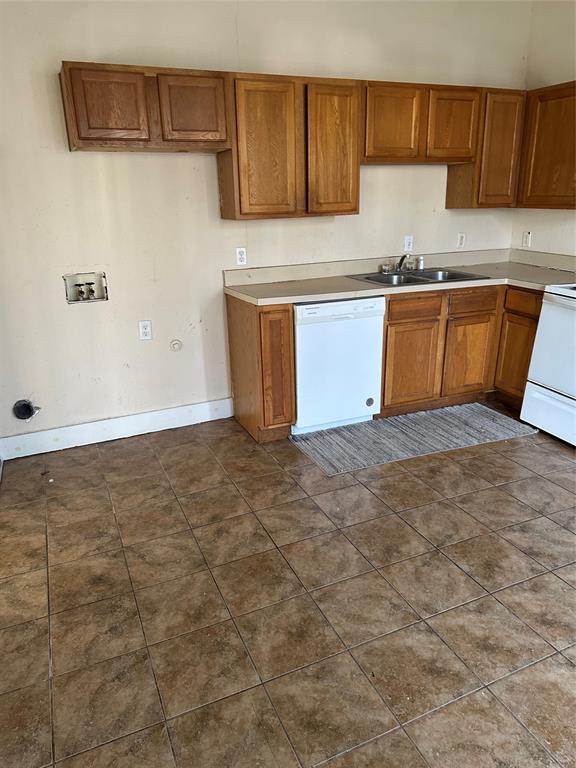 607 Northwest Main Ennis, TX 75119 - Photo 11 of 16 Kitchen area. Left side is location of washer-dryer connections