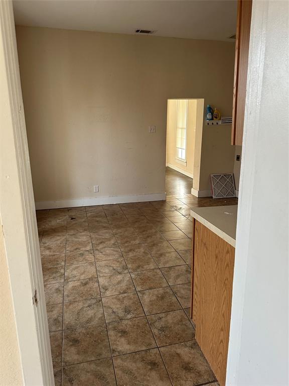 607 Northwest Main Ennis, TX 75119 - Photo 10 of 16 Kitchen area looking onto eat-in kitchen area