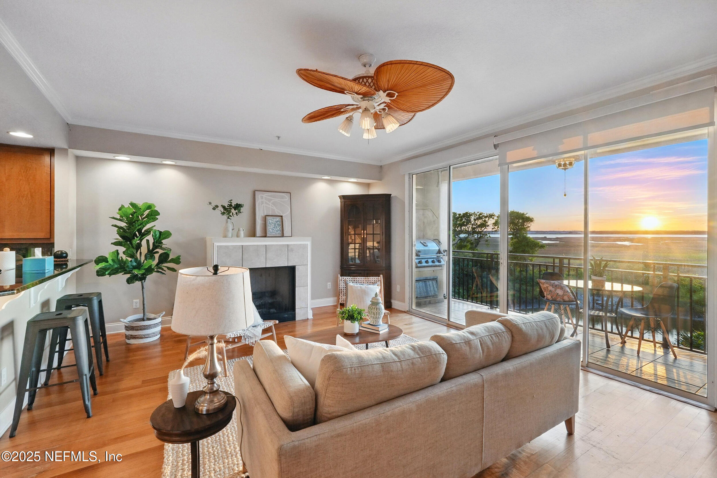 2102 Windjammer Lane St. Augustine, FL 32084 - Photo 12 of 47 a living room with furniture a chandelier and a large window