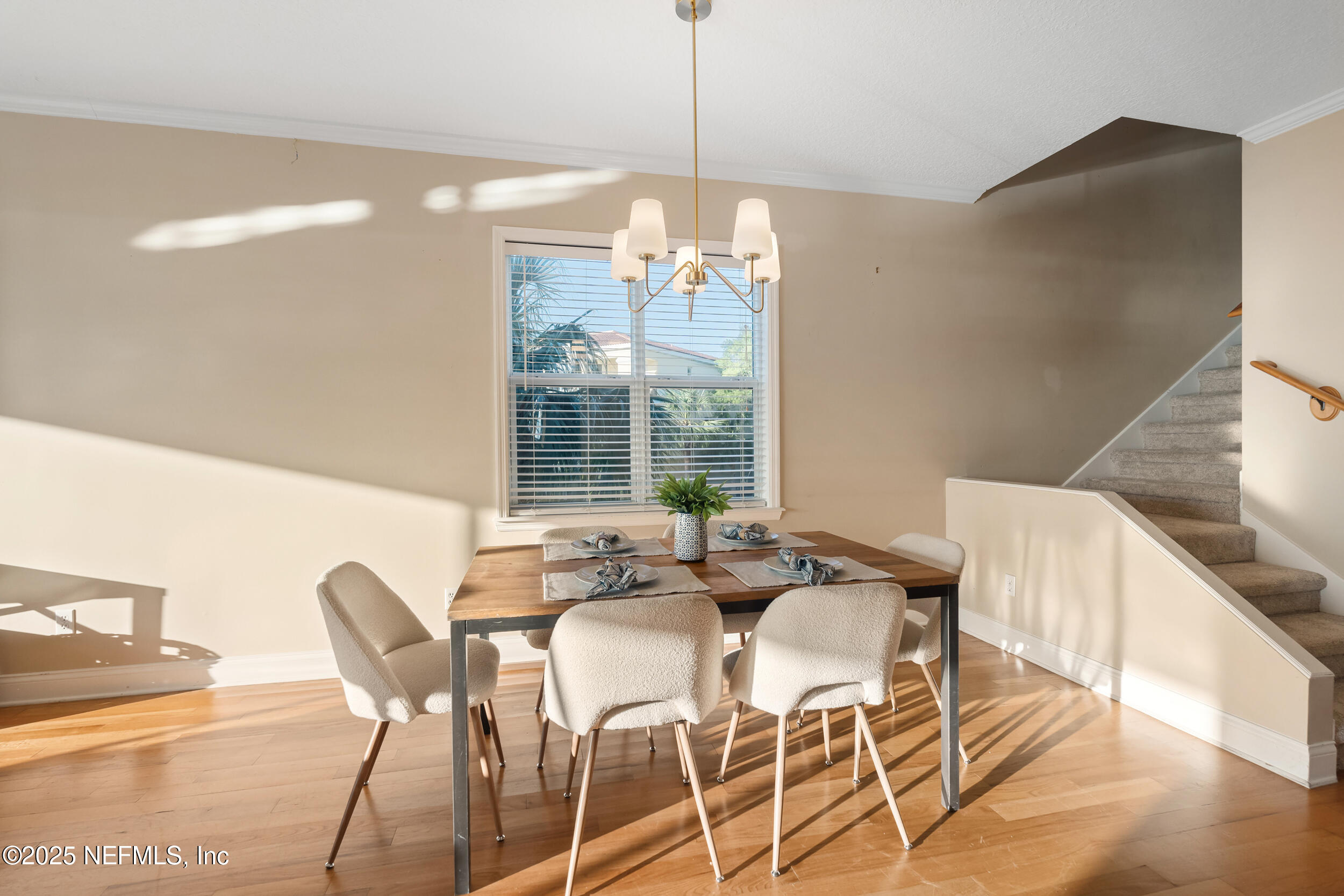 2102 Windjammer Lane St. Augustine, FL 32084 - Photo 15 of 47 a view of a dining room with furniture large windows and wooden floor