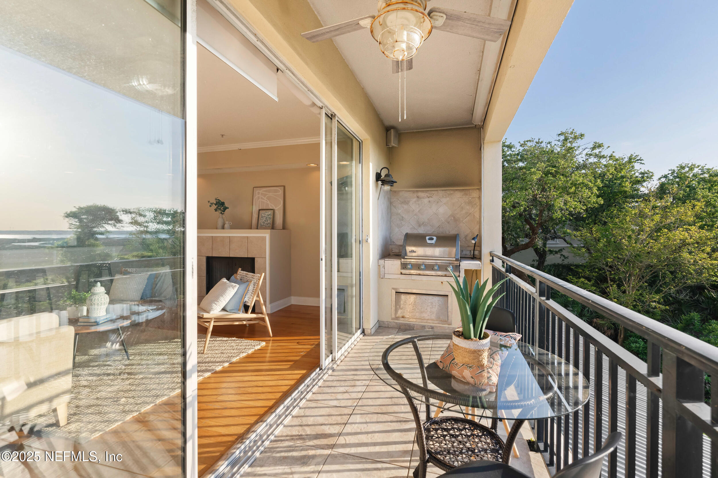 2102 Windjammer Lane St. Augustine, FL 32084 - Photo 22 of 47 a balcony with wooden floor table and chairs