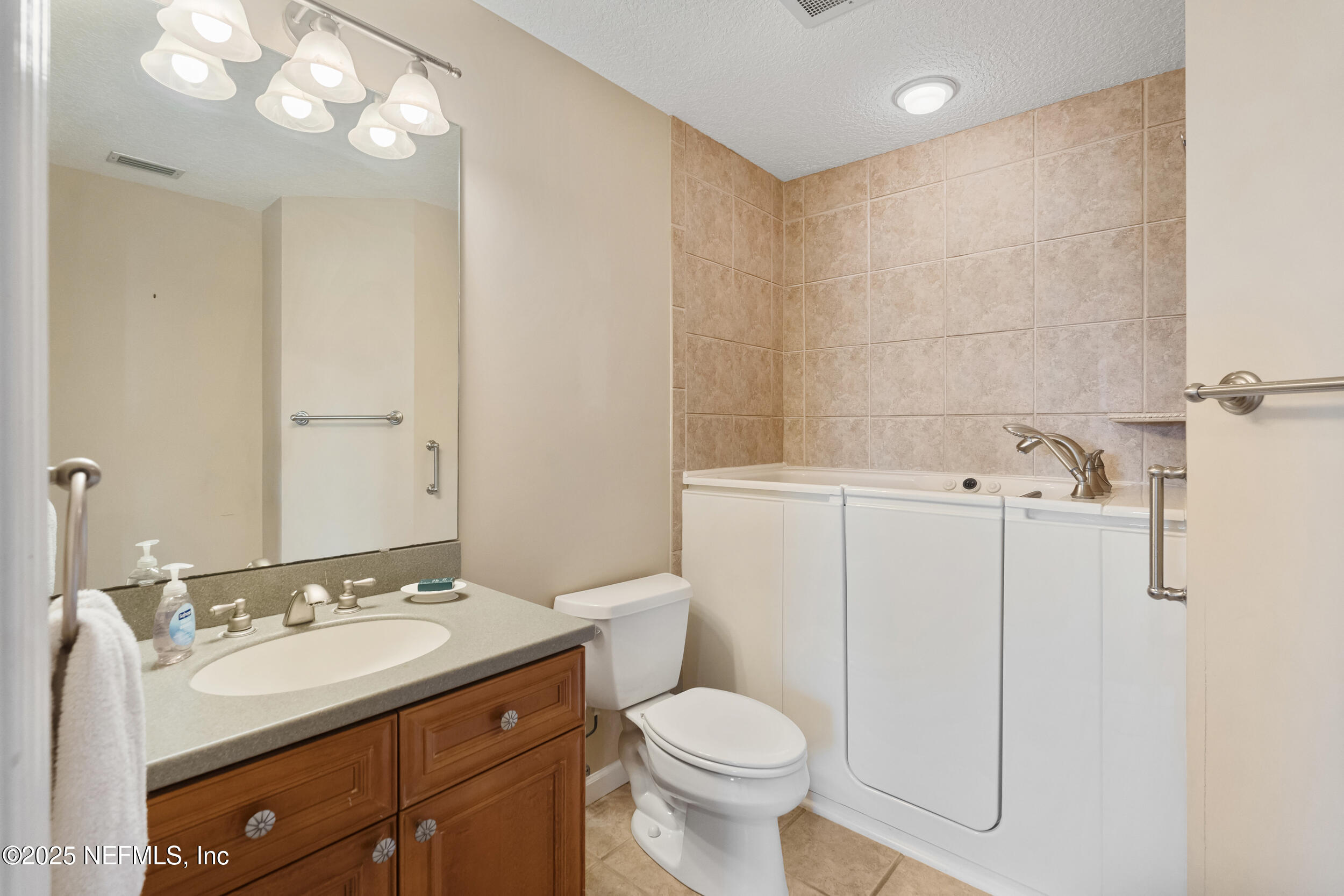 2102 Windjammer Lane St. Augustine, FL 32084 - Photo 33 of 47 a bathroom with a sink toilet and vanity