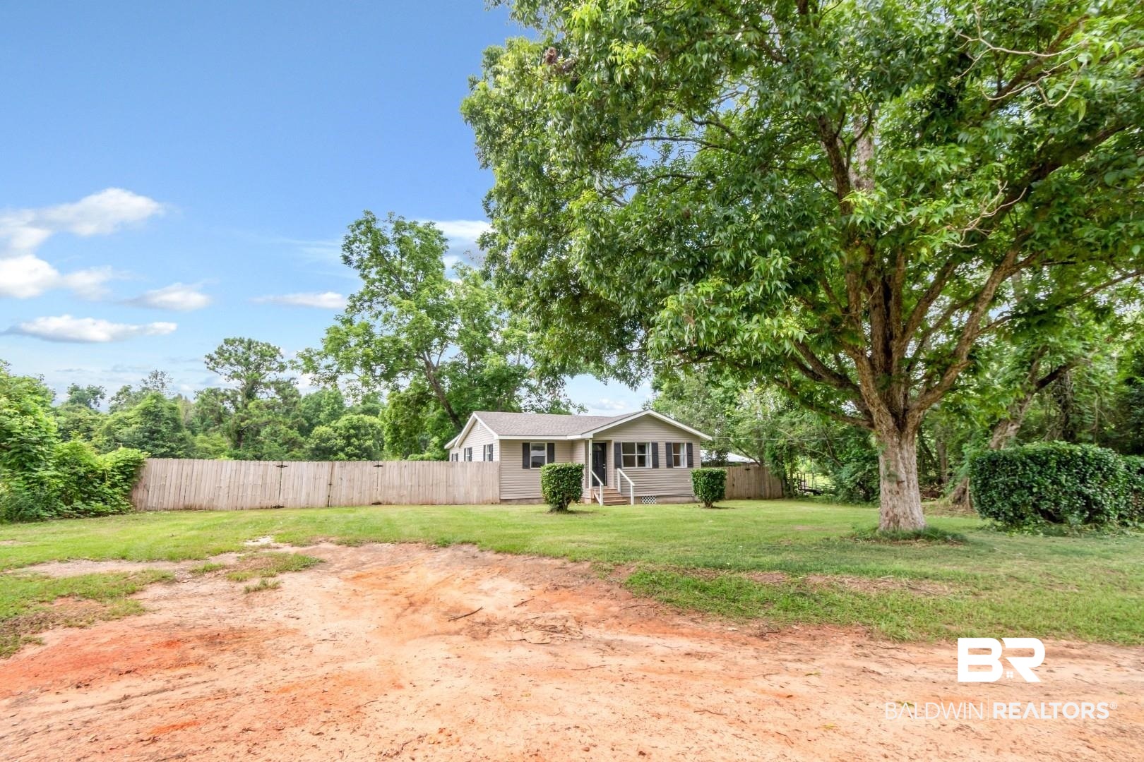 2905A McFarland Road, Unit F Mobile, AL 36695 - Photo 20 of 29 Exterior featuring light gray siding, white trim, and dark shutters