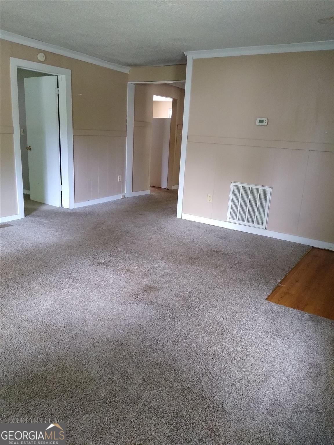225 South Webb Street Hartwell, GA 30643 - Photo 3 of 24 a view of an empty room with a window