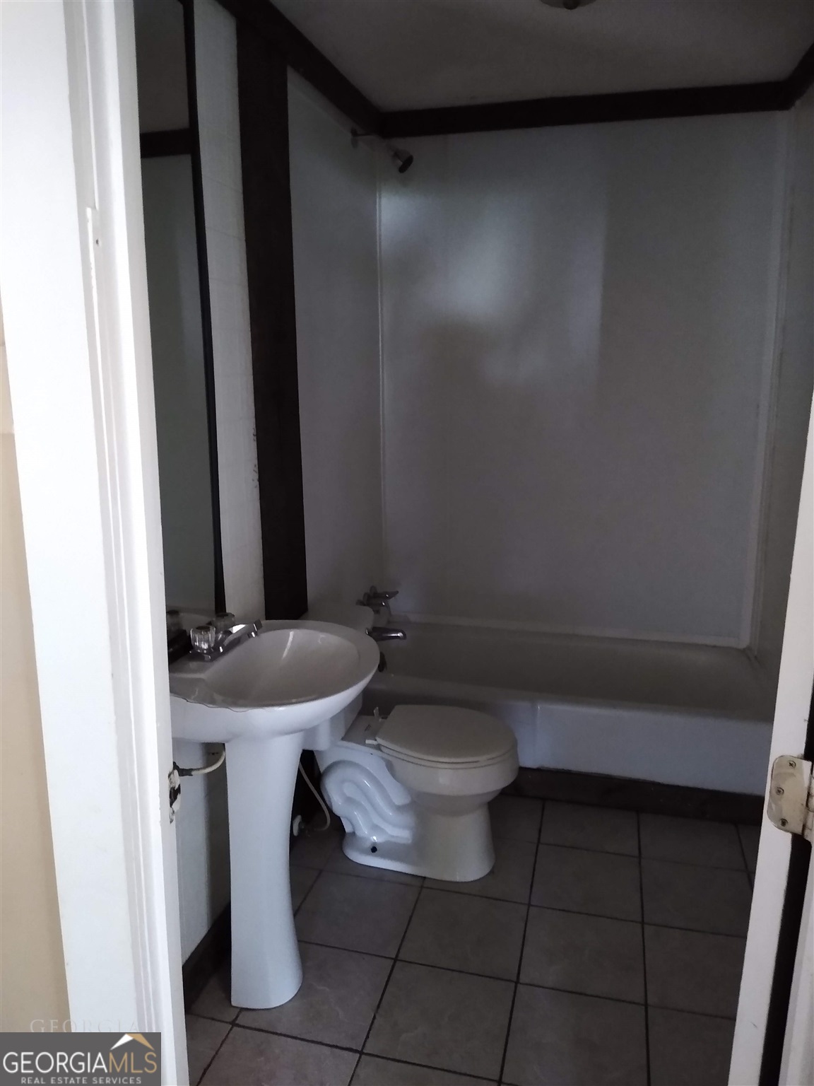 225 South Webb Street Hartwell, GA 30643 - Photo 7 of 24 a bathroom with a sink a toilet and mirror