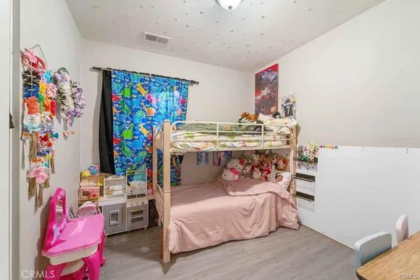 a bedroom with furniture and a bed